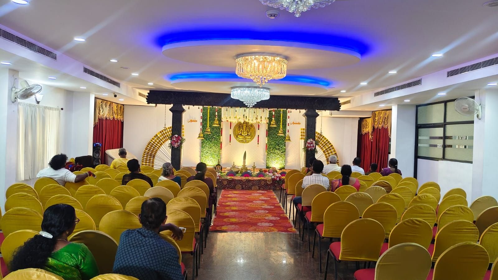 Wedding mandapam with carved pillars and brass lamps
